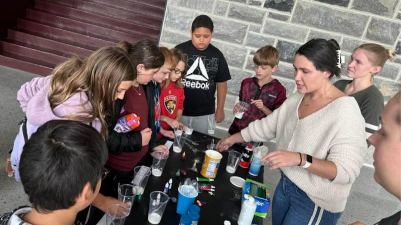 fifth-grade students engaging in hands-on activities with exhibitors at Hokie for a Day. 