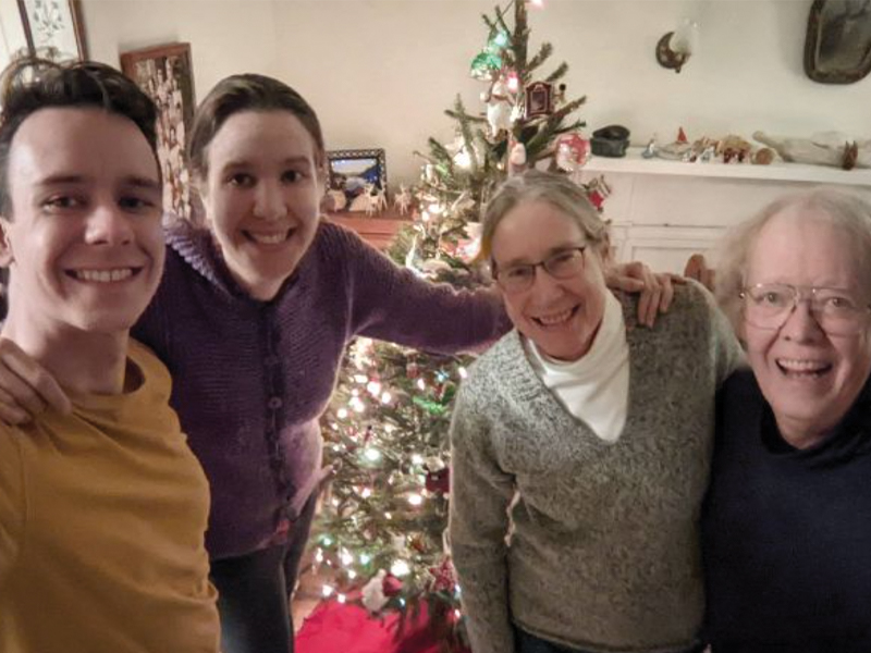 Caption: Carrie (second from right) was delighted to have her whole family together at Christmas after two years of pandemic separation. Pictured left to right, Edmund Hughes, Camilla Hughes, Carrie Kroehler, and Michael Hughes.